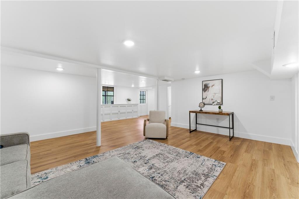 2975 Nursery Road Southeast Smyrna, GA 30082 - Photo 21 of 36 a living room with furniture and wooden floor