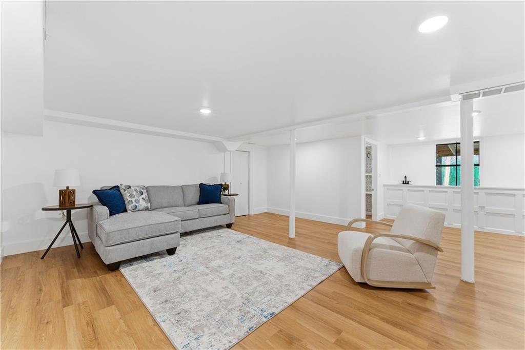 2975 Nursery Road Southeast Smyrna, GA 30082 - Photo 23 of 36 a living room with furniture and a wooden floor