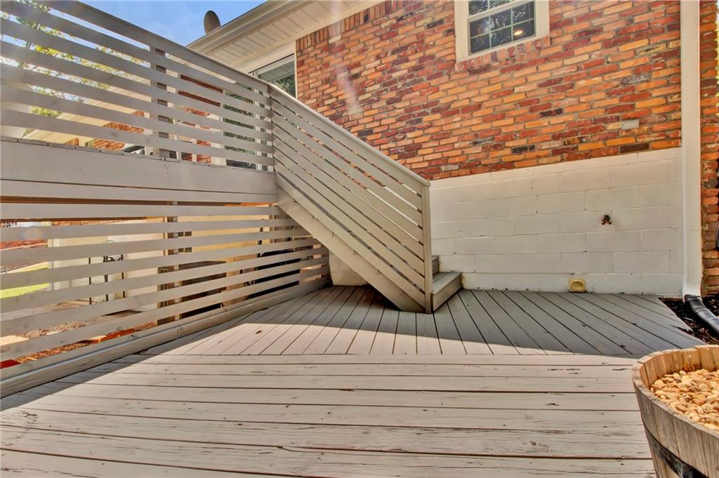2975 Nursery Road Southeast Smyrna, GA 30082 - Photo 28 of 36 a view of a balcony with wooden floor and staircase