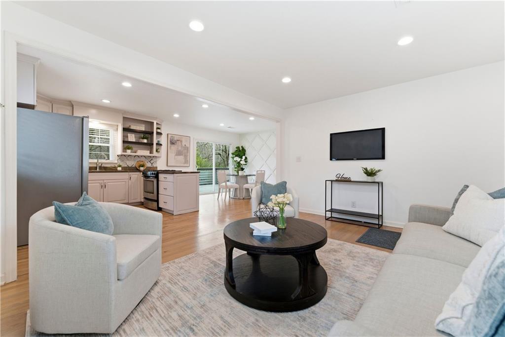 2975 Nursery Road Southeast Smyrna, GA 30082 - Photo 3 of 36 a living room with furniture and a flat screen tv