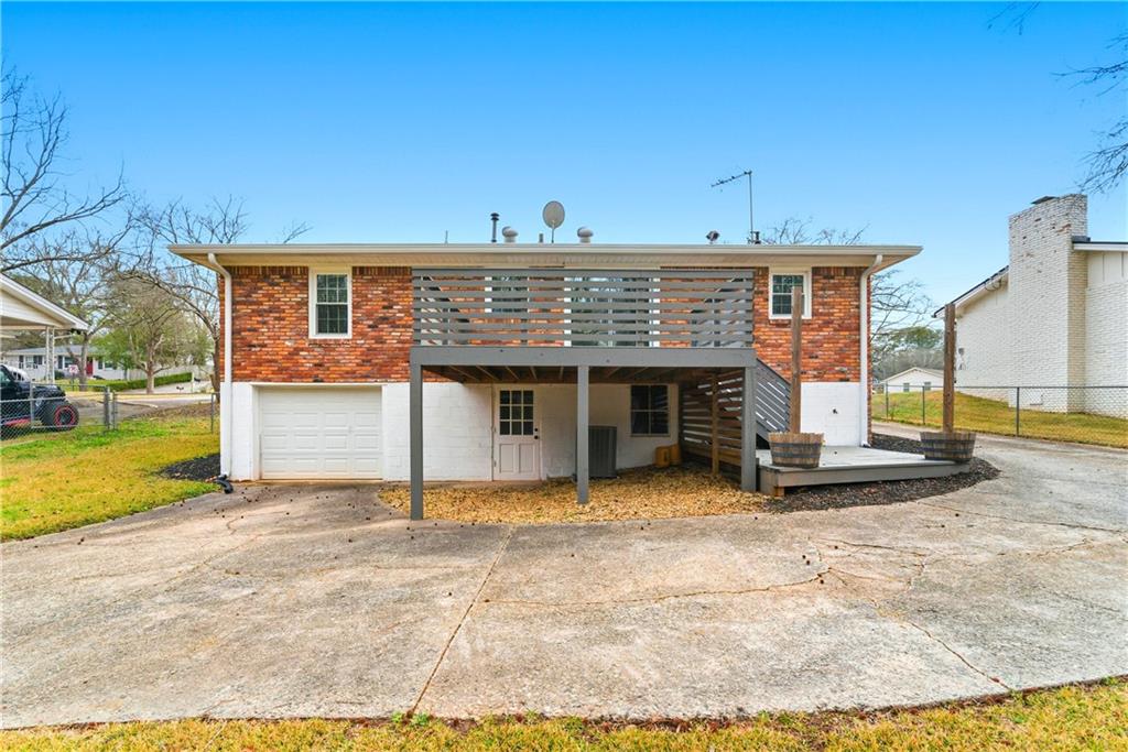 2975 Nursery Road Southeast Smyrna, GA 30082 - Photo 32 of 36 a view of a house with backyard and a tree