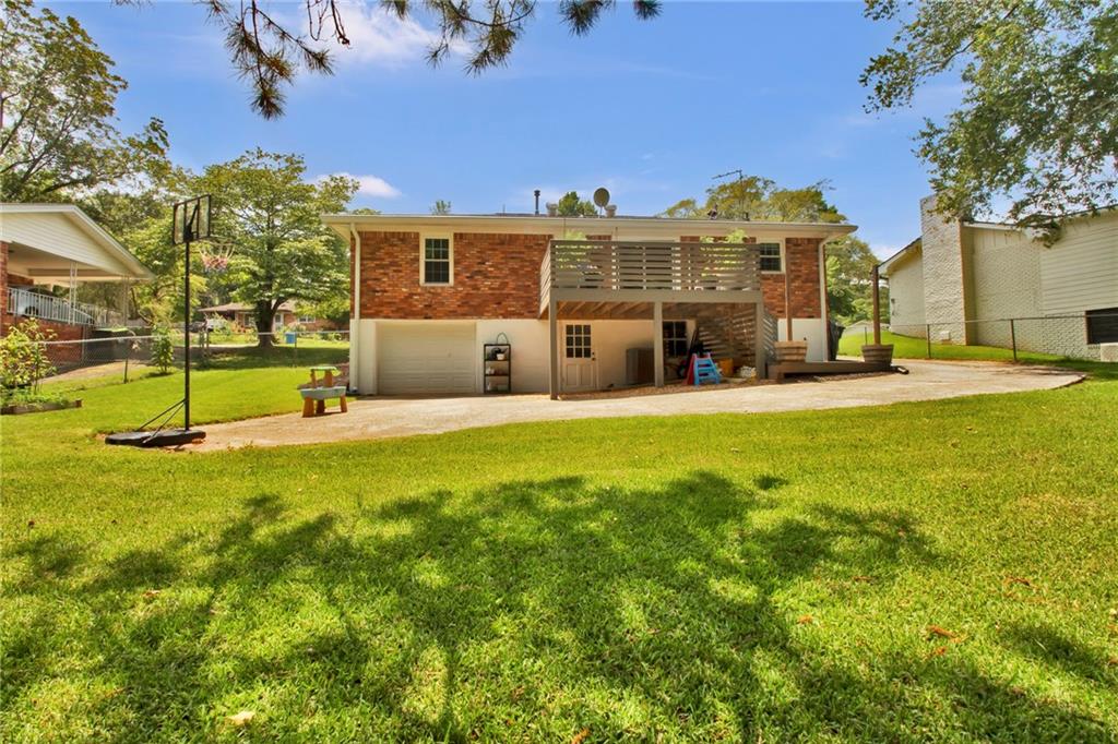 2975 Nursery Road Southeast Smyrna, GA 30082 - Photo 33 of 36 a view of a house with a big yard and large trees