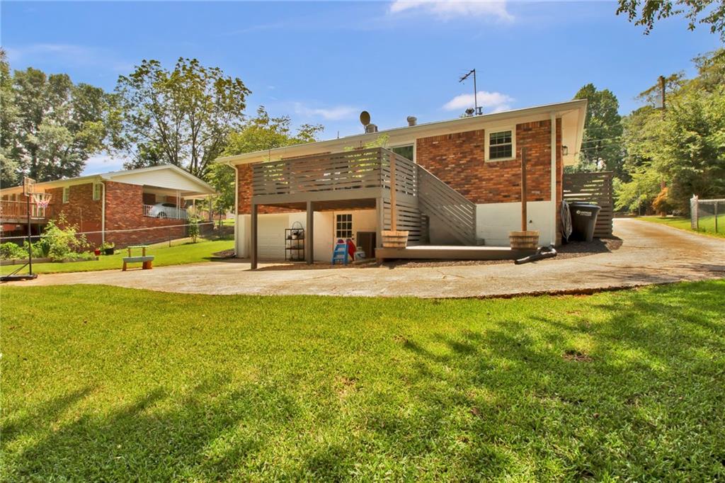 2975 Nursery Road Southeast Smyrna, GA 30082 - Photo 34 of 36 a front view of a house with a yard