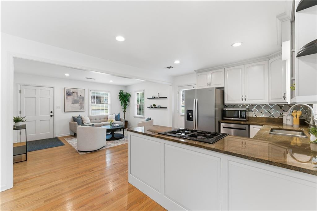 2975 Nursery Road Southeast Smyrna, GA 30082 - Photo 4 of 36 a kitchen with sink refrigerator and microwave
