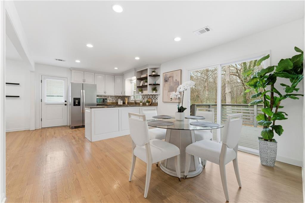 2975 Nursery Road Southeast Smyrna, GA 30082 - Photo 7 of 36 a kitchen with stainless steel appliances granite countertop a refrigerator and a stove top oven