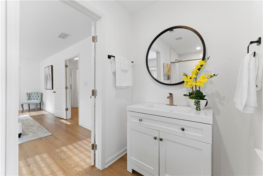 2975 Nursery Road Southeast Smyrna, GA 30082 - Photo 9 of 36 a bathroom with a sink and a mirror