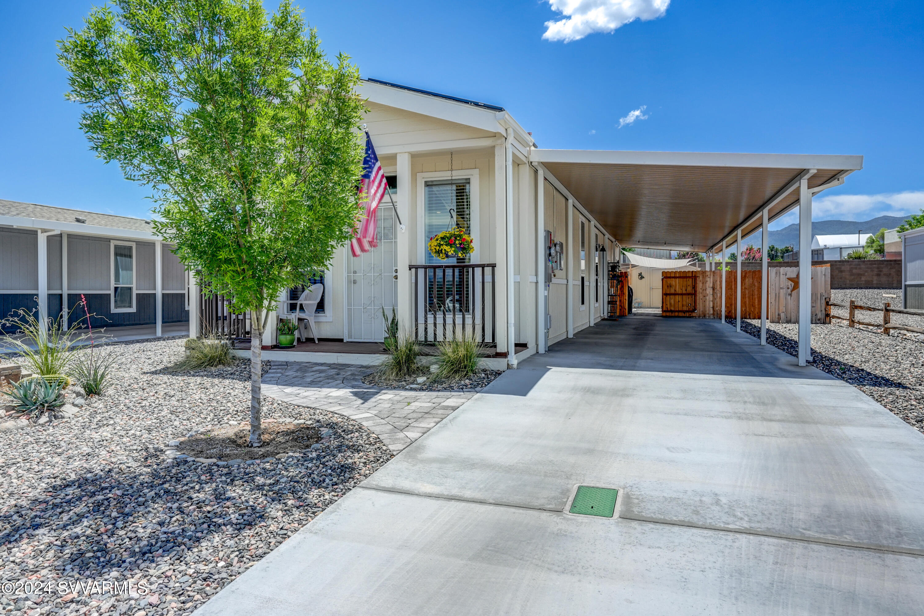 999 Thorton Road, Unit 21 Camp Verde, AZ 86322 - Photo 1 of 23 a view of a house with plants and a tree