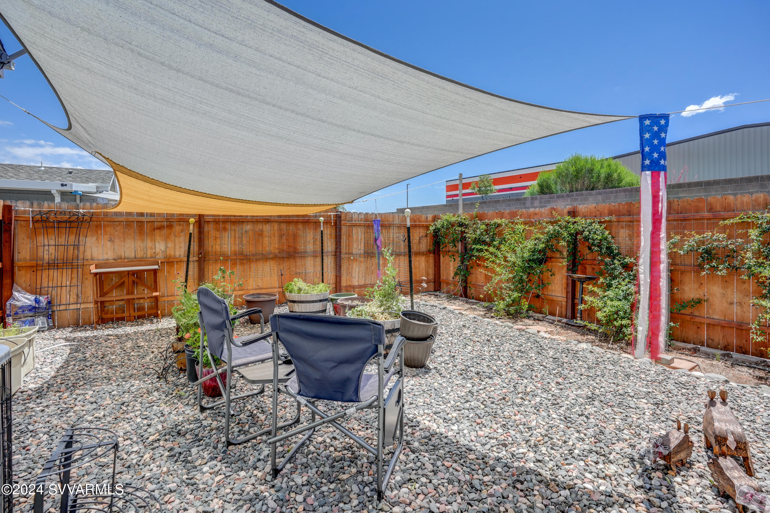 999 Thorton Road, Unit 21 Camp Verde, AZ 86322 - Photo 21 of 23 a backyard of a house with barbeque oven table and chairs