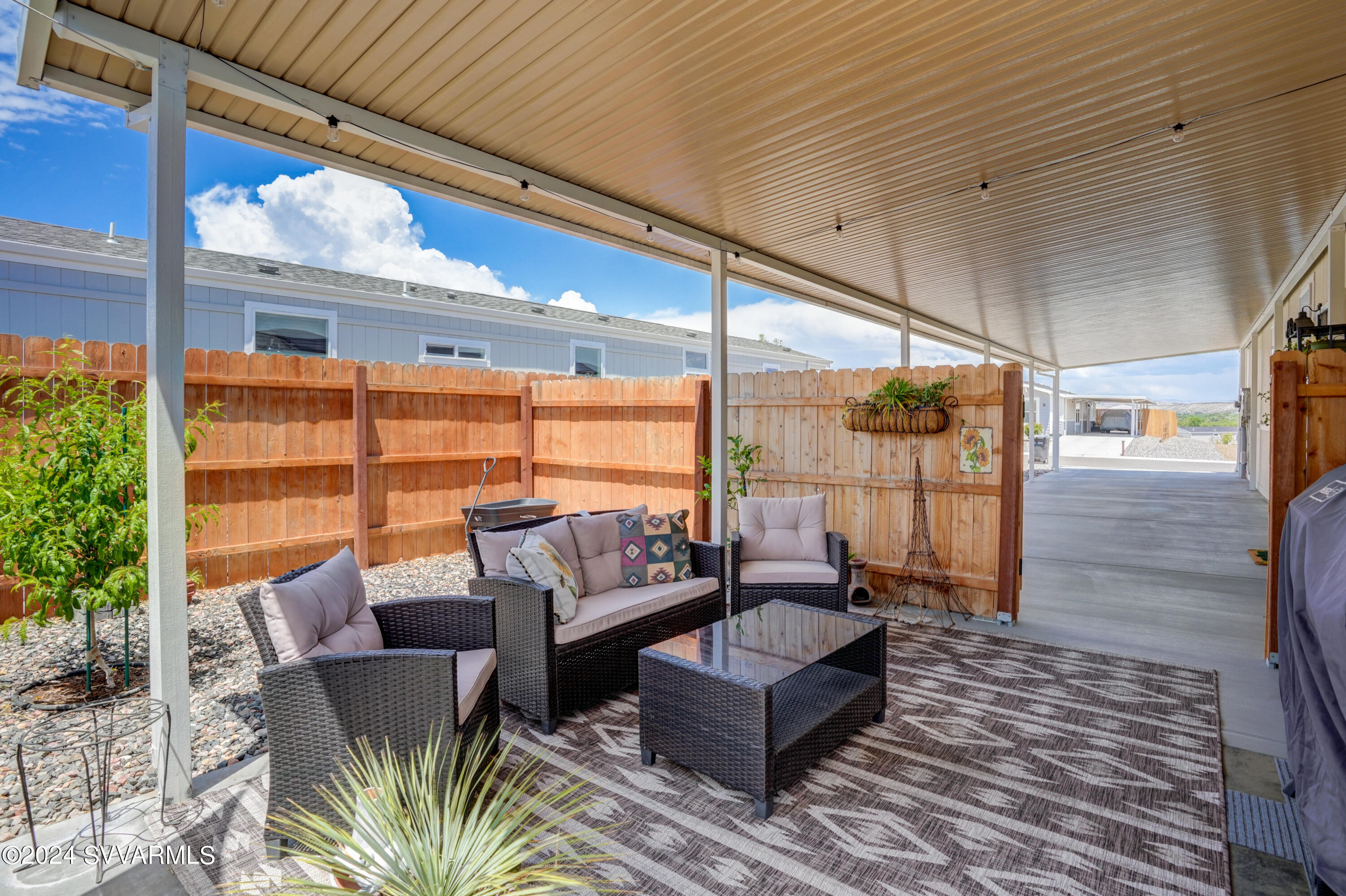 999 Thorton Road, Unit 21 Camp Verde, AZ 86322 - Photo 22 of 23 a outdoor living space with patio furniture and a potted plant