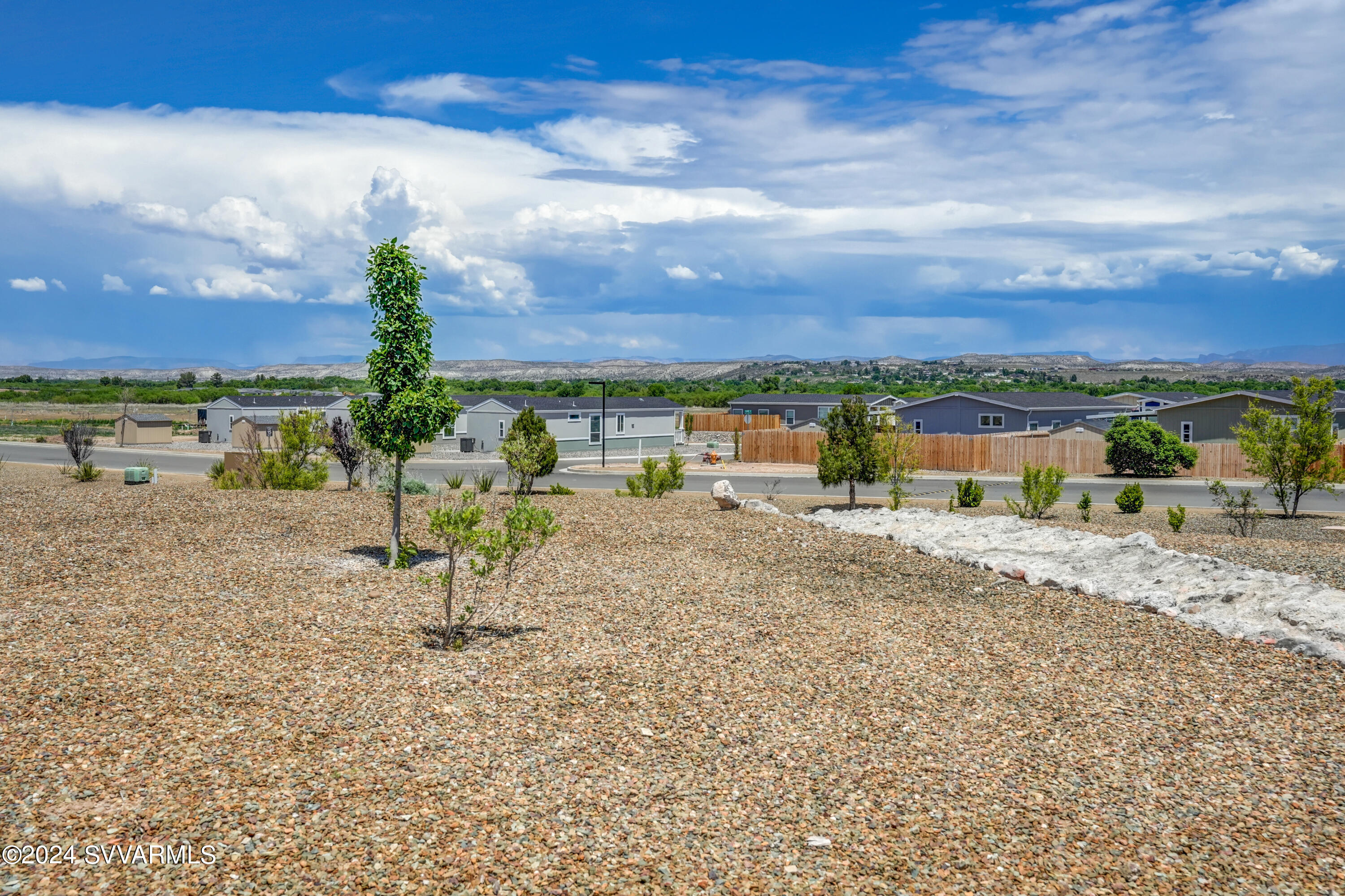 999 Thorton Road, Unit 21 Camp Verde, AZ 86322 - Photo 3 of 23 a view of a lake with a yard