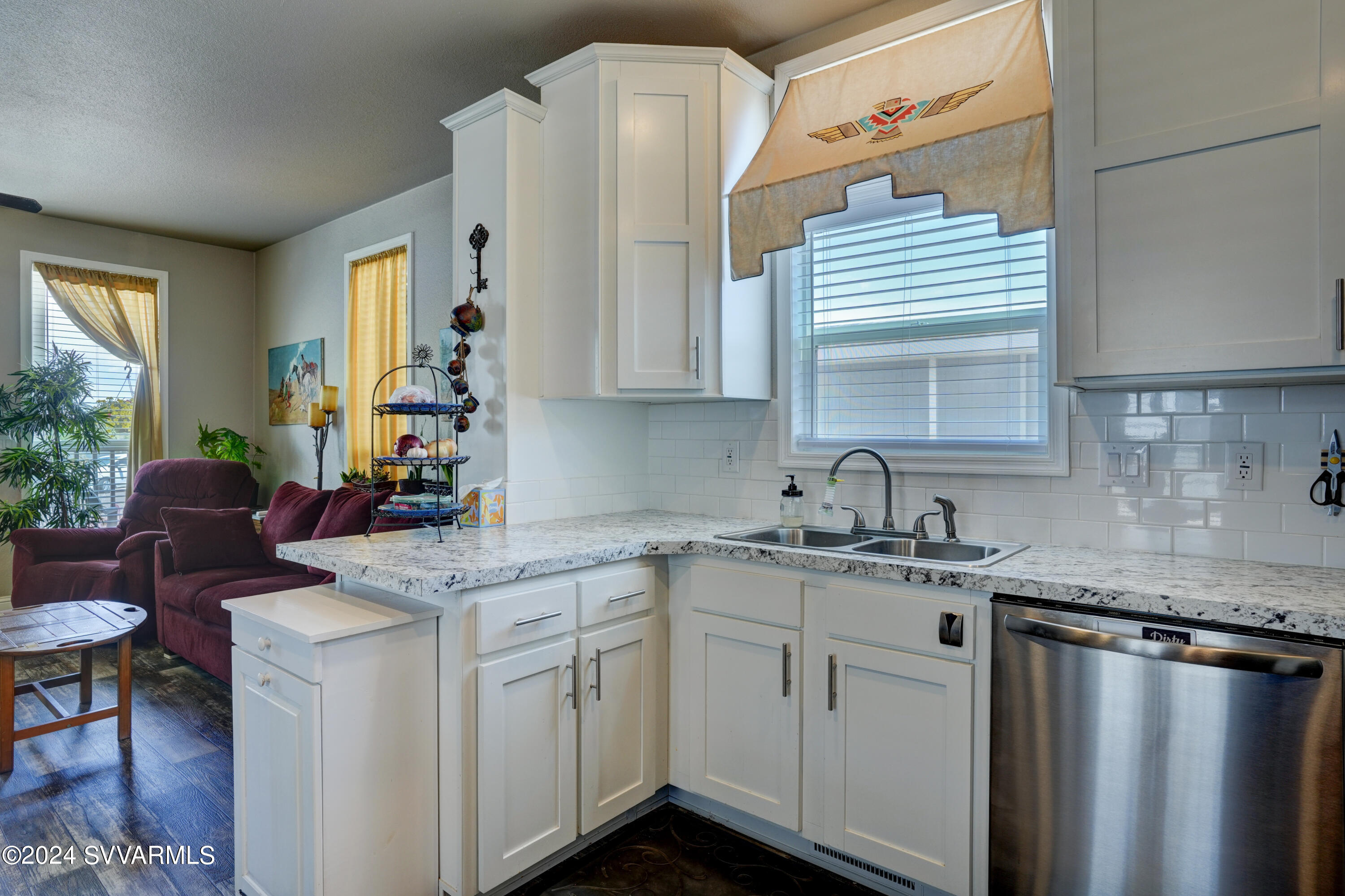 999 Thorton Road, Unit 21 Camp Verde, AZ 86322 - Photo 7 of 23 a kitchen with stainless steel appliances granite countertop a sink stove and cabinets
