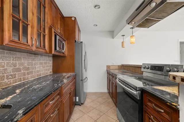 a kitchen with a stove and a sink