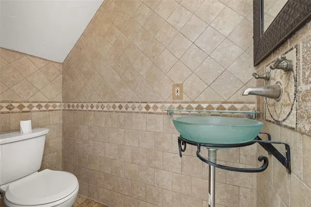 a bathroom with a toilet bathtub and shower