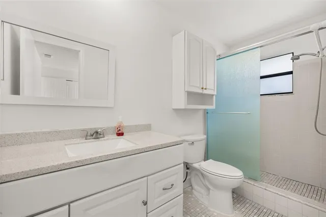 a bathroom with a sink toilet and vanity