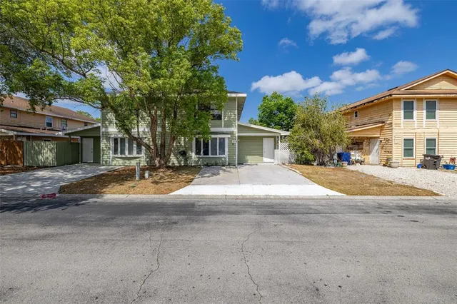 a view of road with house in the background