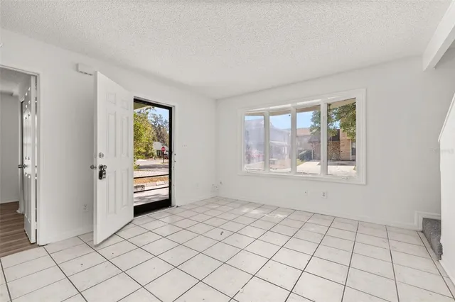 a view of an empty room and window