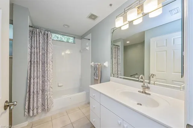 a bathroom with a bathtub and a sink
