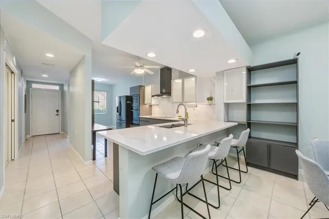 a kitchen with a table and chairs in it