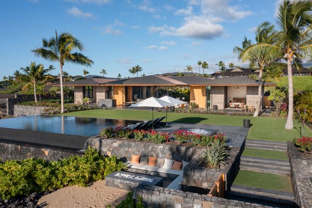 a view of a patio with table and chairs potted plants