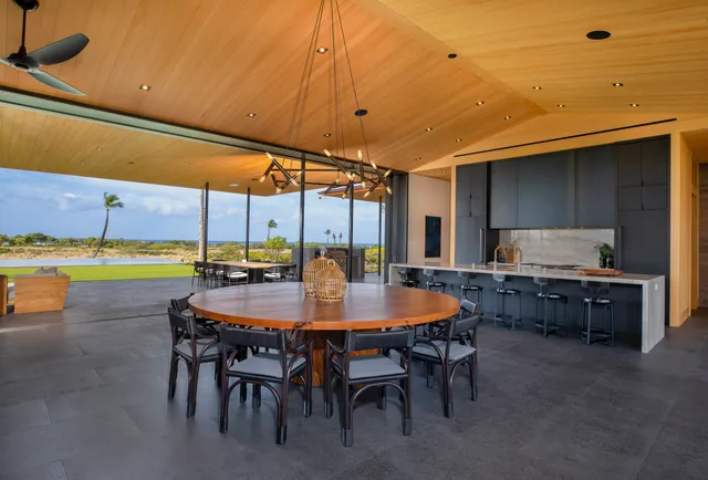 a dining room with a table and chairs