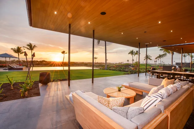 a view of a patio with a table and chairs