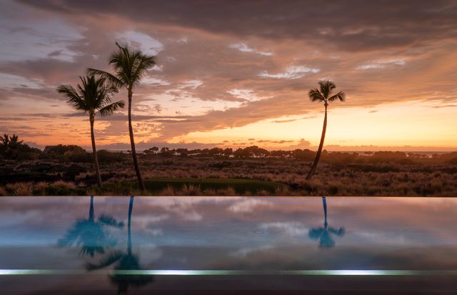 a view of a water from a floor to ceiling window