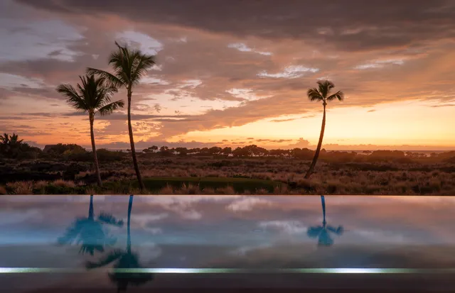 a view of a water from a floor to ceiling window
