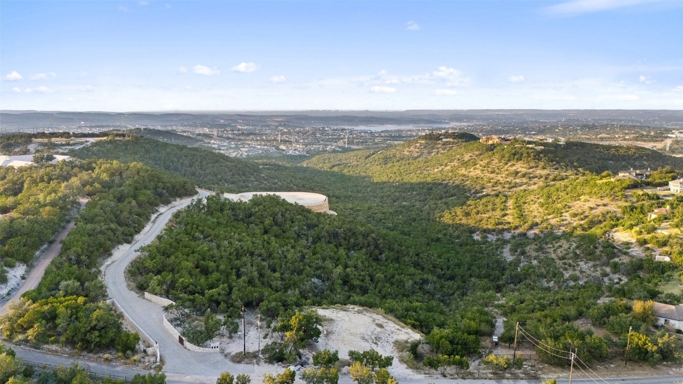 an aerial view of residential building and lake