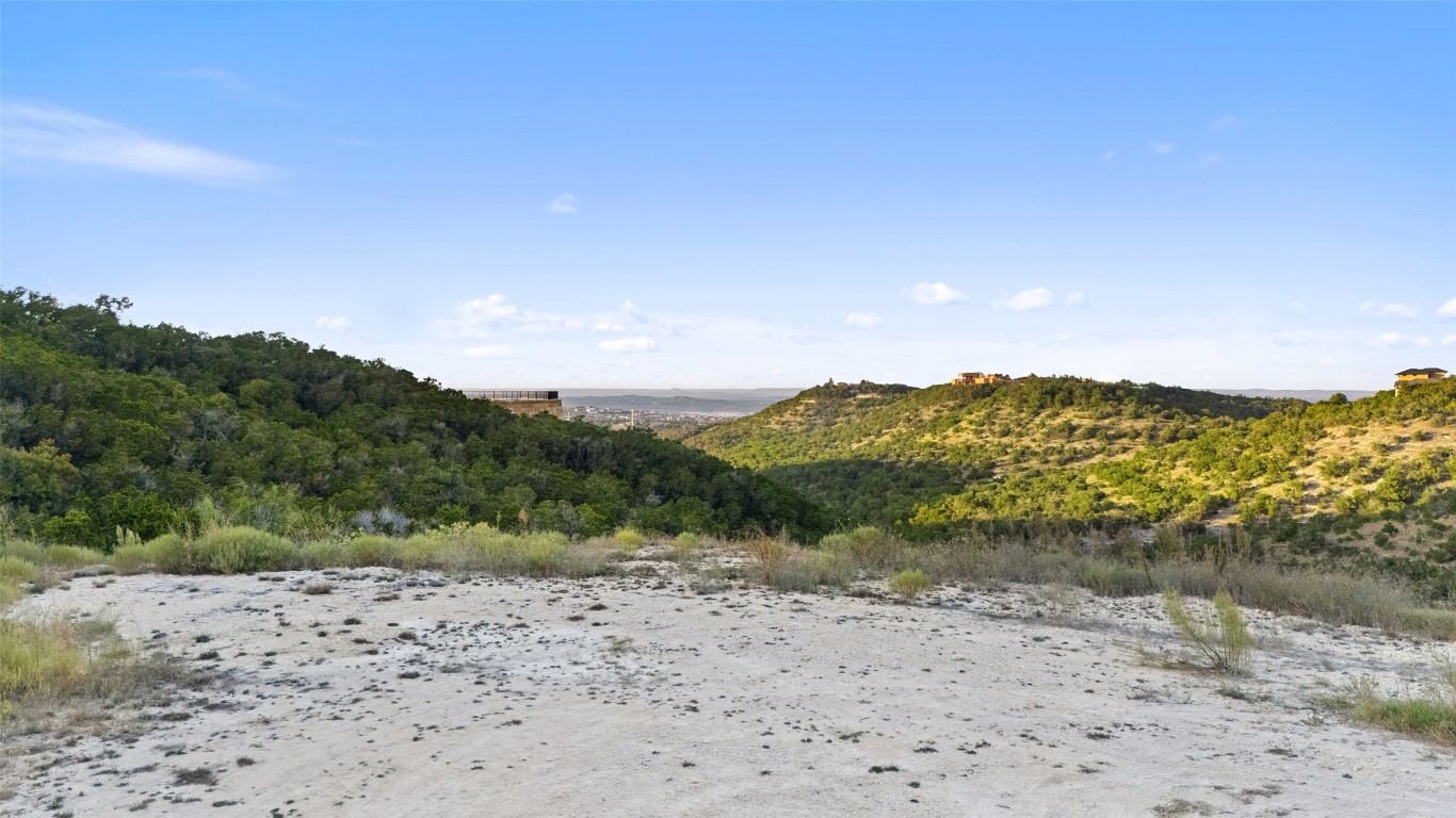 17210 Flint Rock Road Austin, TX 78738 - Photo 4 of 13 a view of a lake with a mountain in the background