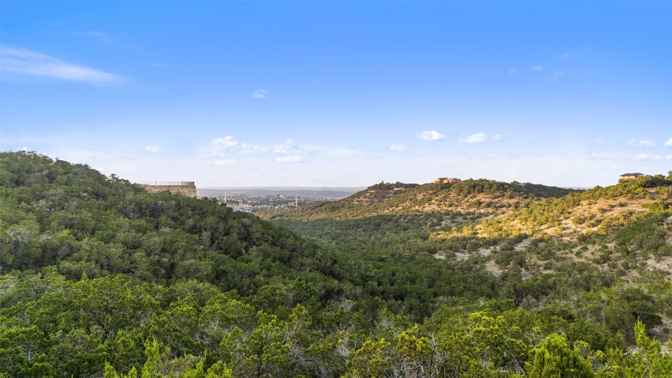 17210 Flint Rock Road Austin, TX 78738 - Photo 8 of 13 a view of a mountain range with lush green forest