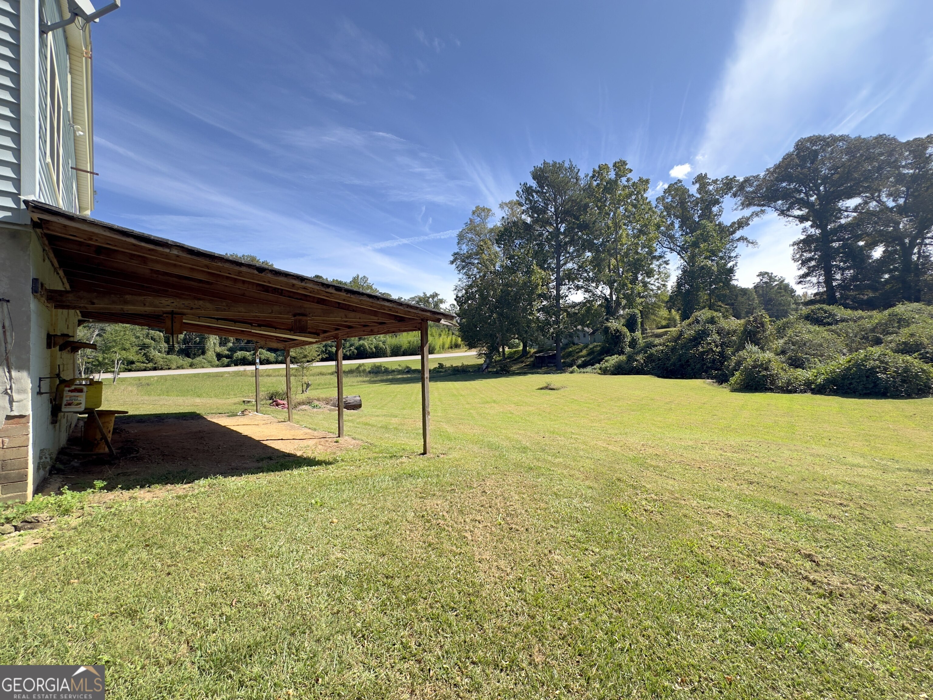 145 Apple Road Thomaston, GA 30286 - Photo 19 of 43 a view of a garden with a slide