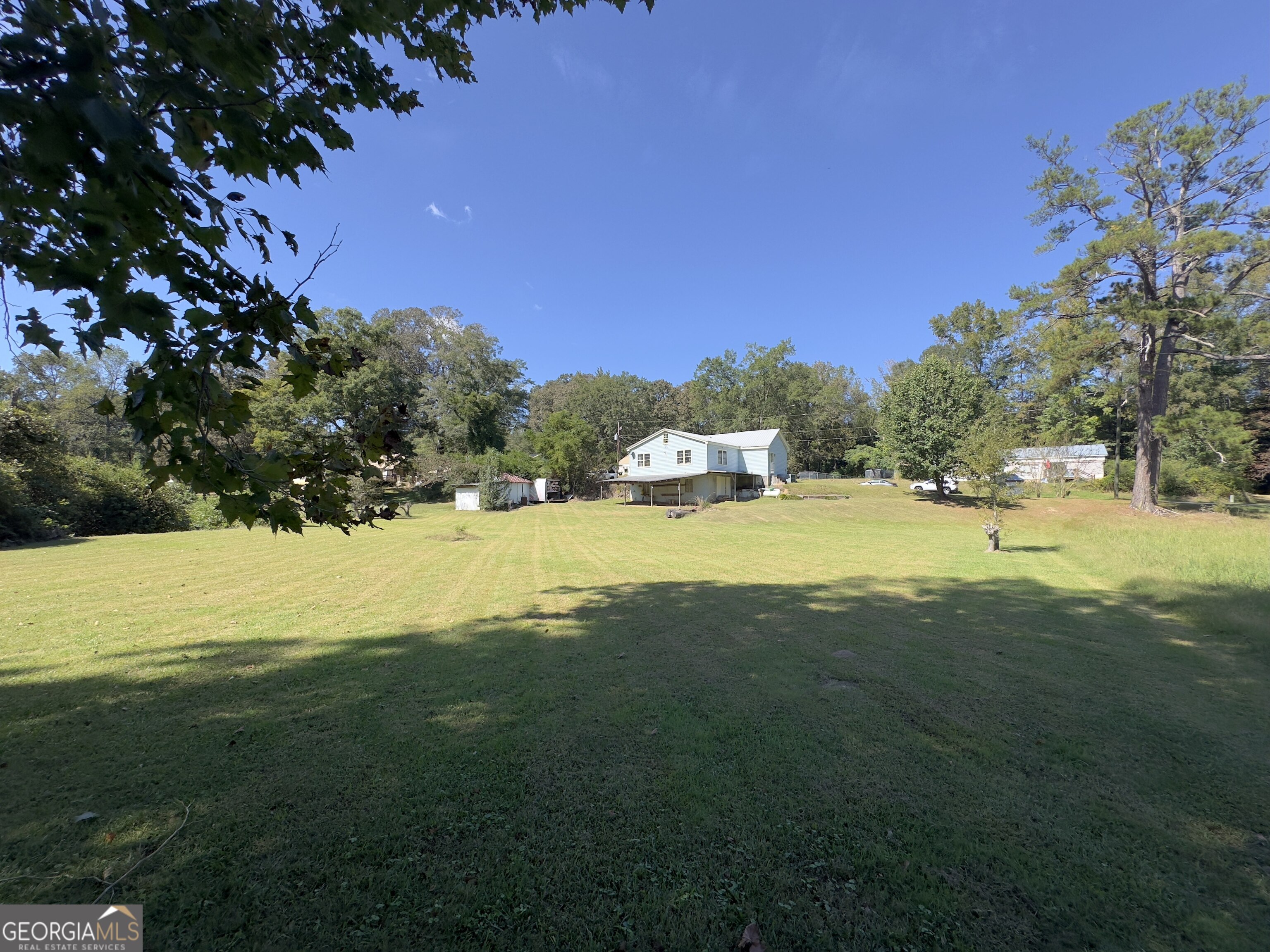 145 Apple Road Thomaston, GA 30286 - Photo 20 of 43 a view of an outdoor space and swimming pool