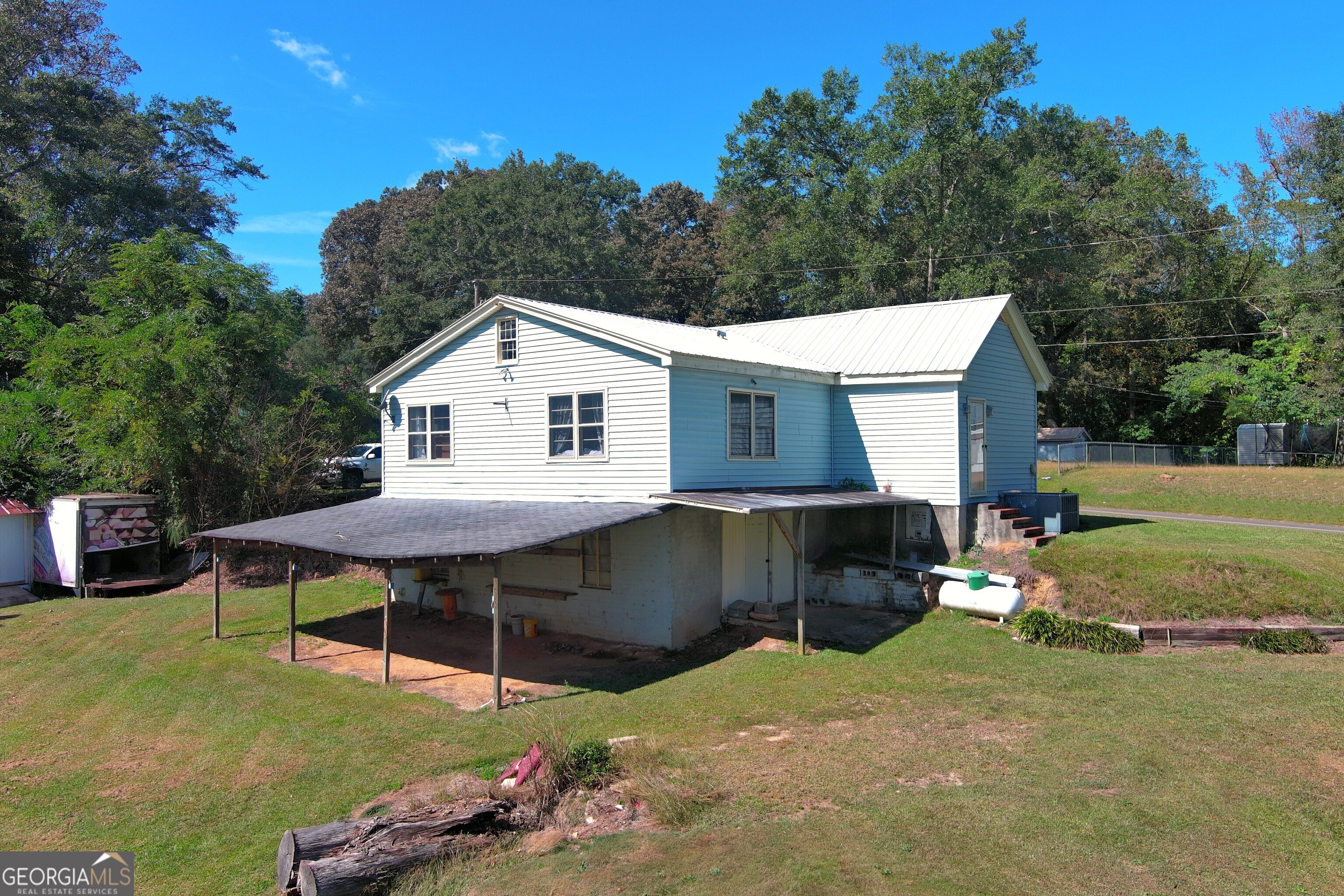 145 Apple Road Thomaston, GA 30286 - Photo 2 of 43 a view of a yard in front of house