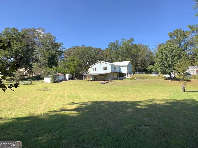 a view of a house with a swimming pool