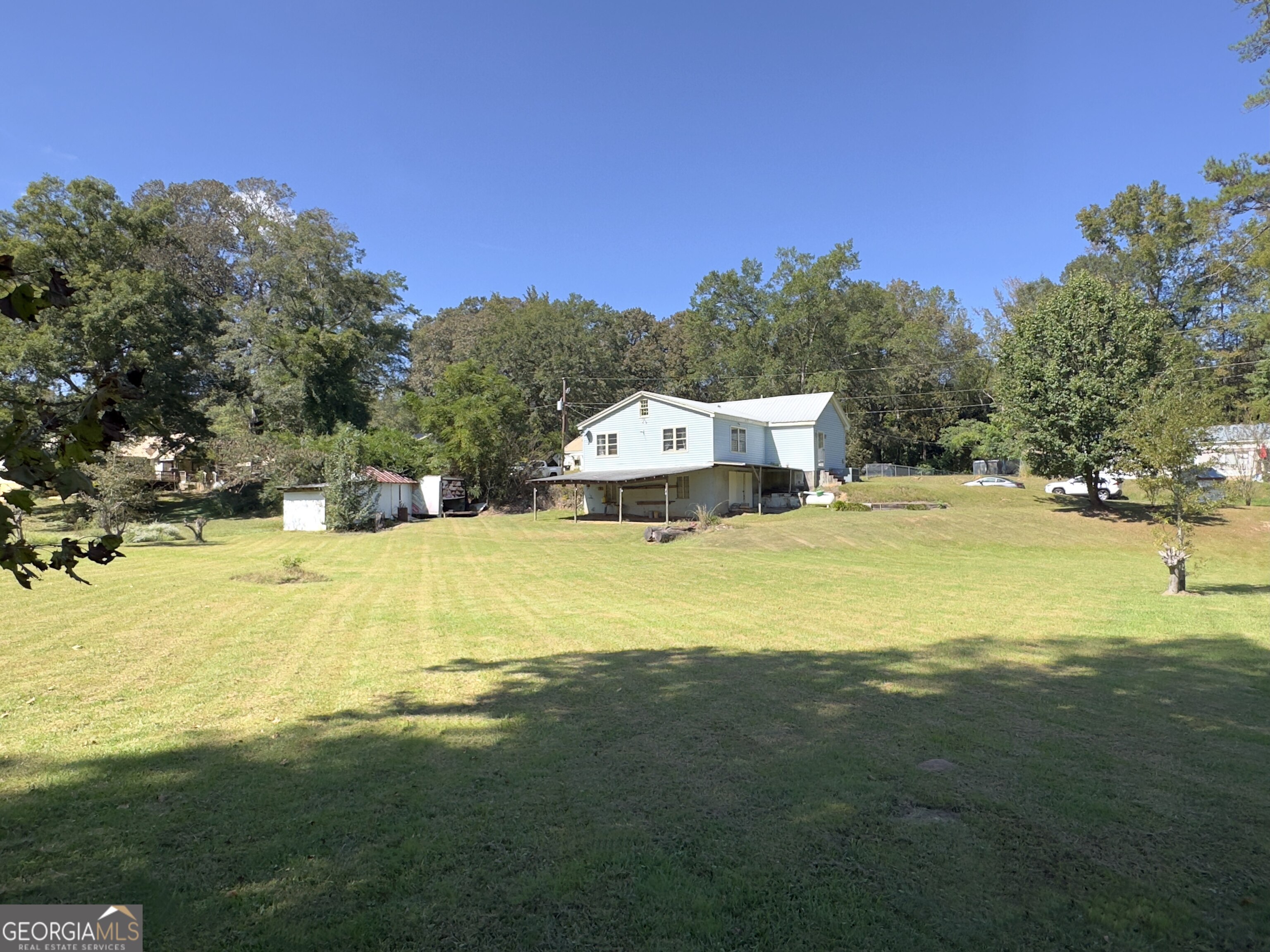 145 Apple Road Thomaston, GA 30286 - Photo 21 of 43 a view of a house with a swimming pool