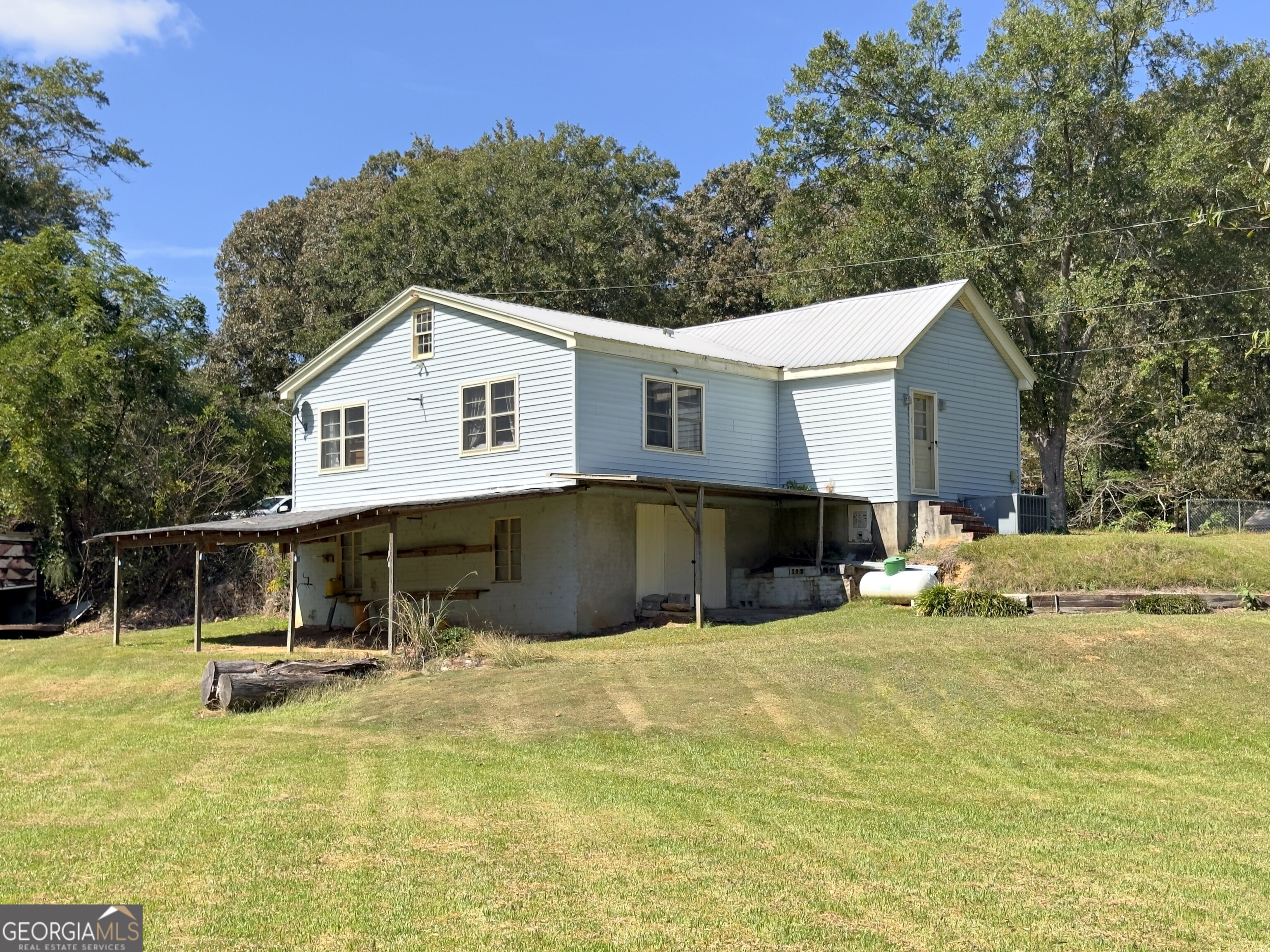 145 Apple Road Thomaston, GA 30286 - Photo 23 of 43 a view of a house with a swimming pool