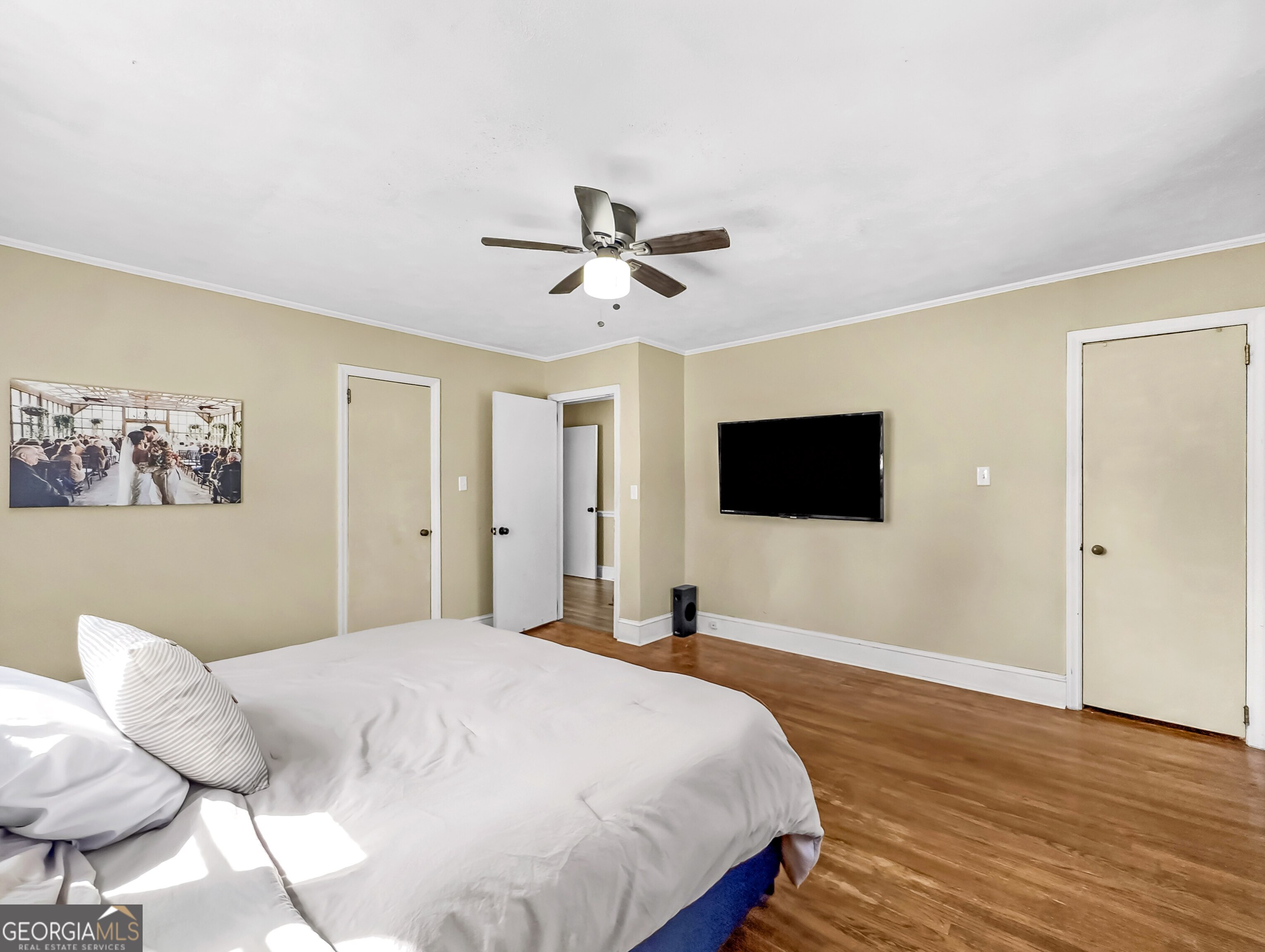 145 Apple Road Thomaston, GA 30286 - Photo 30 of 43 a bedroom with a bed and a flat screen tv