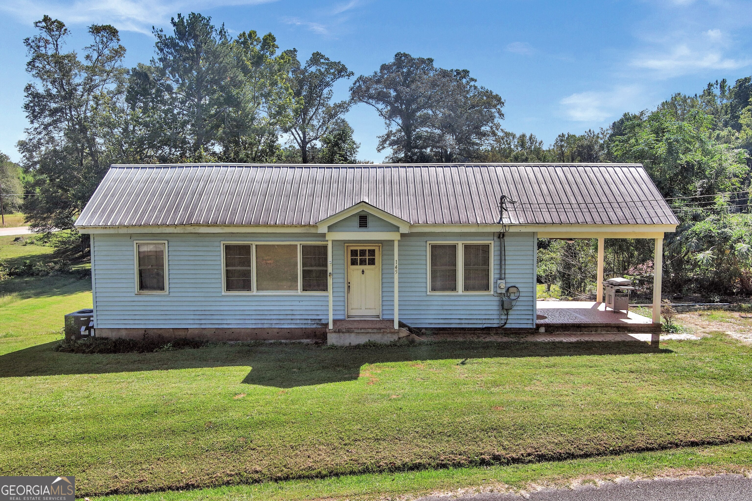 145 Apple Road Thomaston, GA 30286 - Photo 3 of 43 a front view of a house with garden