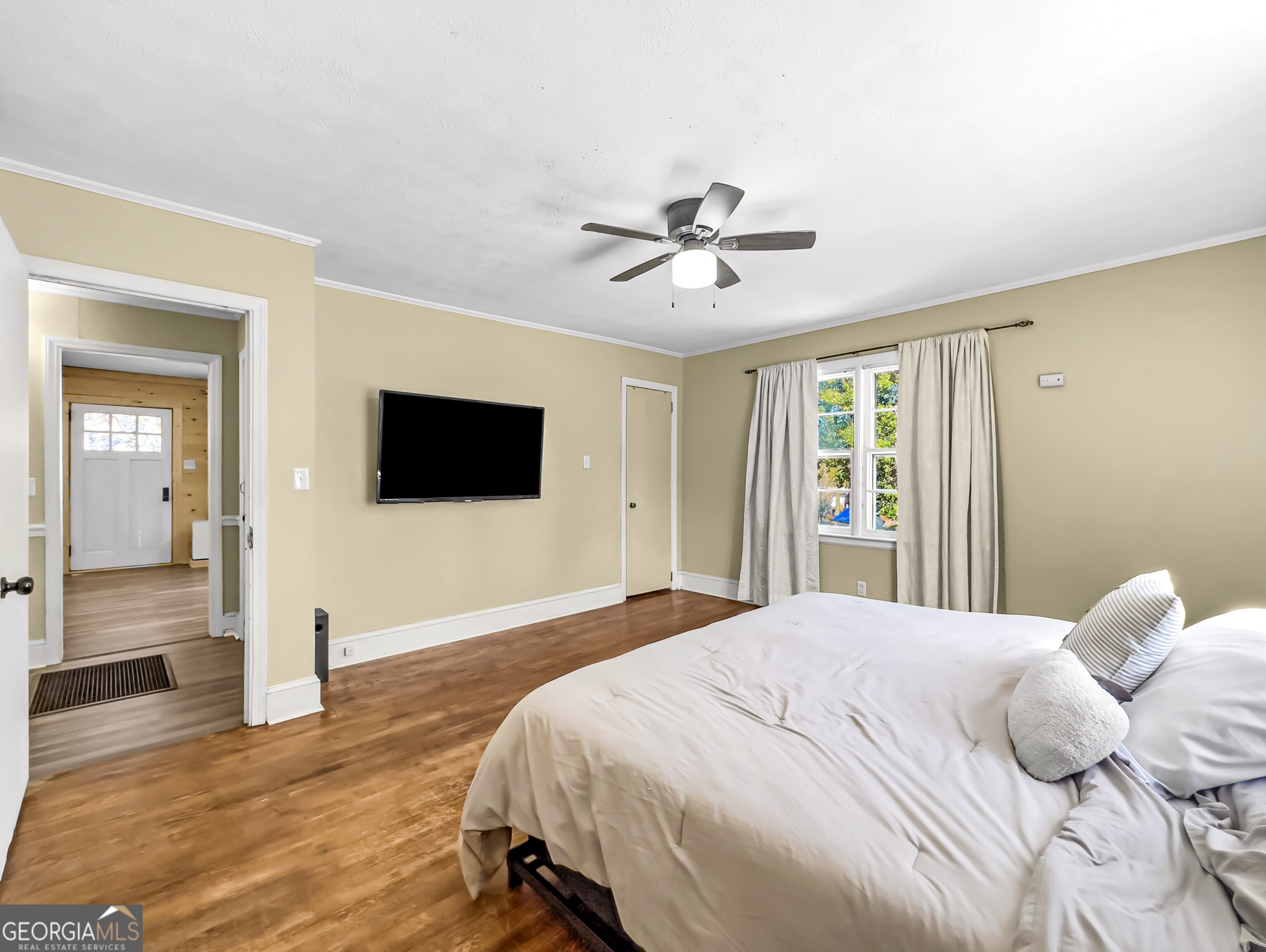 145 Apple Road Thomaston, GA 30286 - Photo 32 of 43 a bedroom with a bed and a flat screen tv