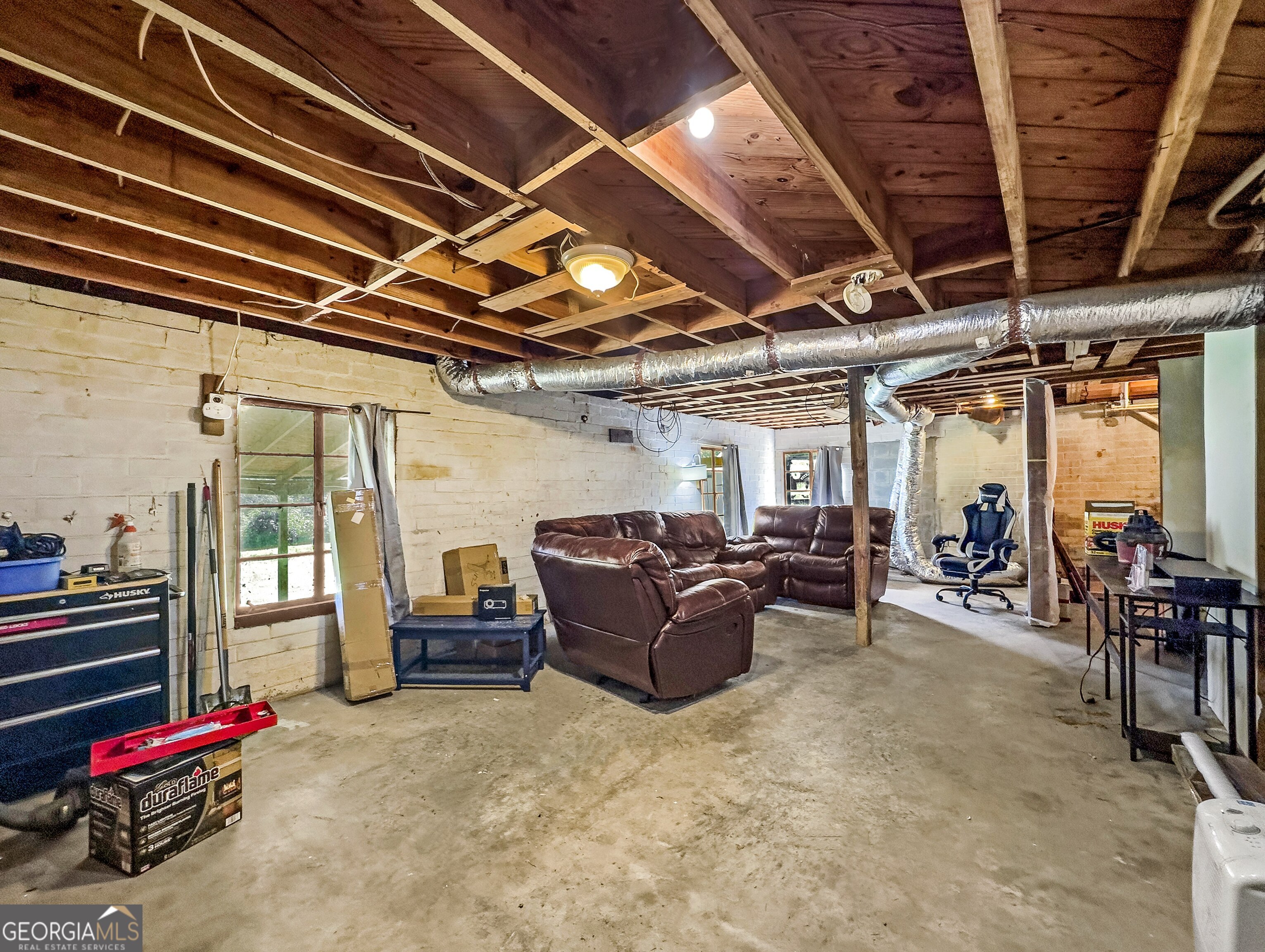145 Apple Road Thomaston, GA 30286 - Photo 37 of 43 a living room with furniture and a flat screen tv