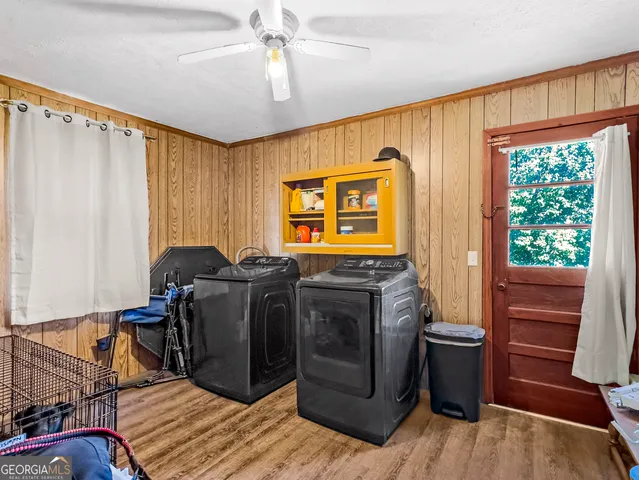 a view of a livingroom with furniture window and wooden floor
