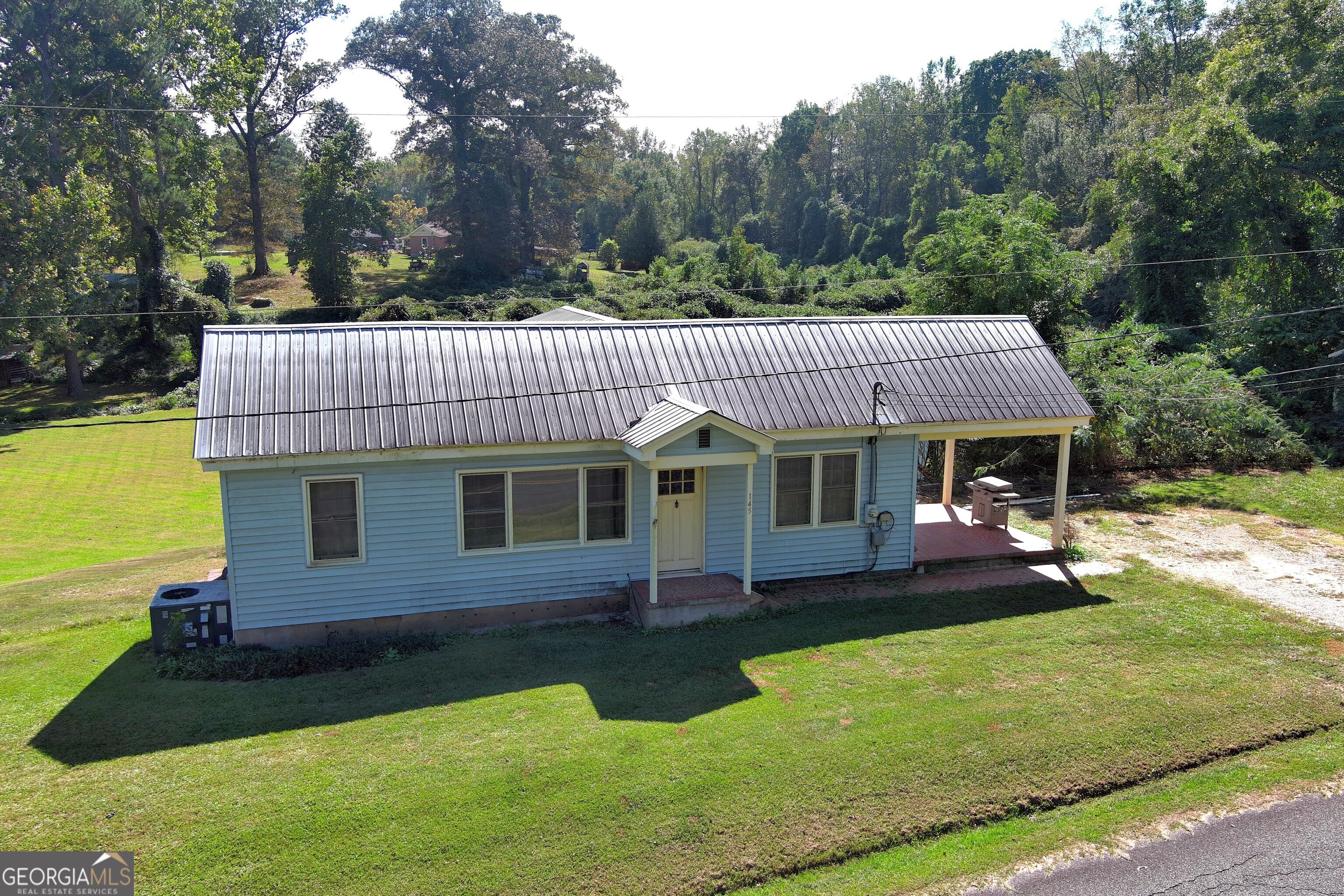 145 Apple Road Thomaston, GA 30286 - Photo 8 of 43 a front view of a house with garden