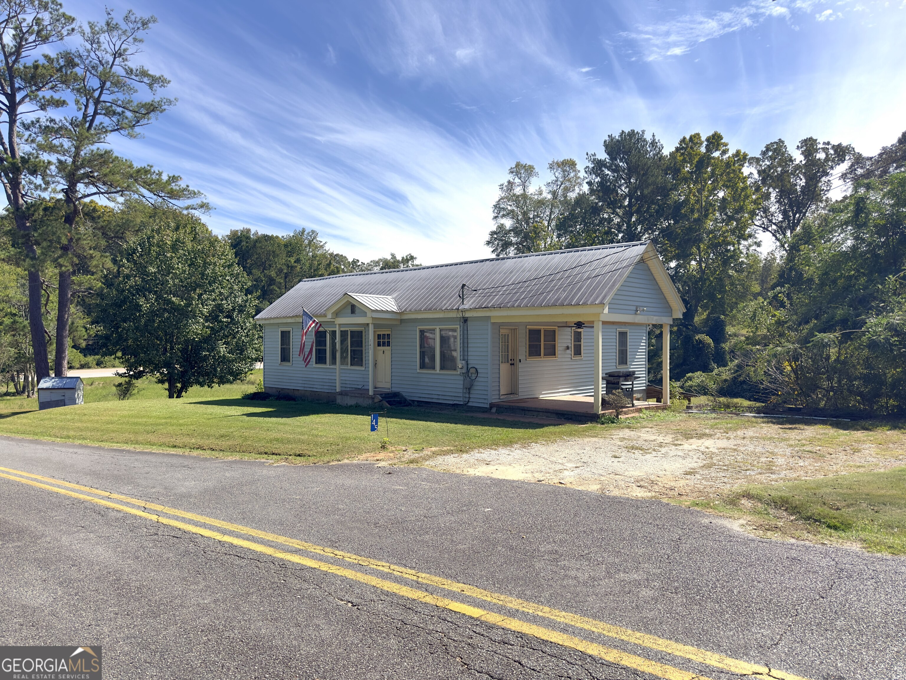 145 Apple Road Thomaston, GA 30286 - Photo 10 of 43 a front view of a house with a yard