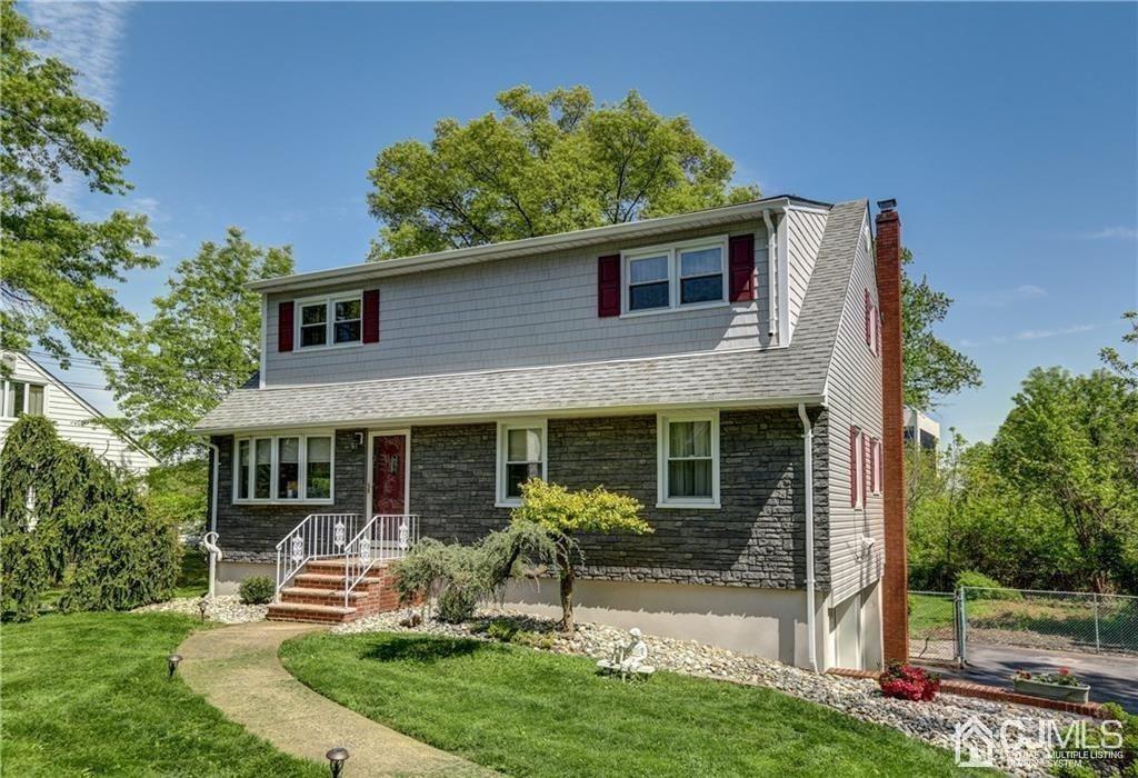 a front view of a house with a yard table and chairs