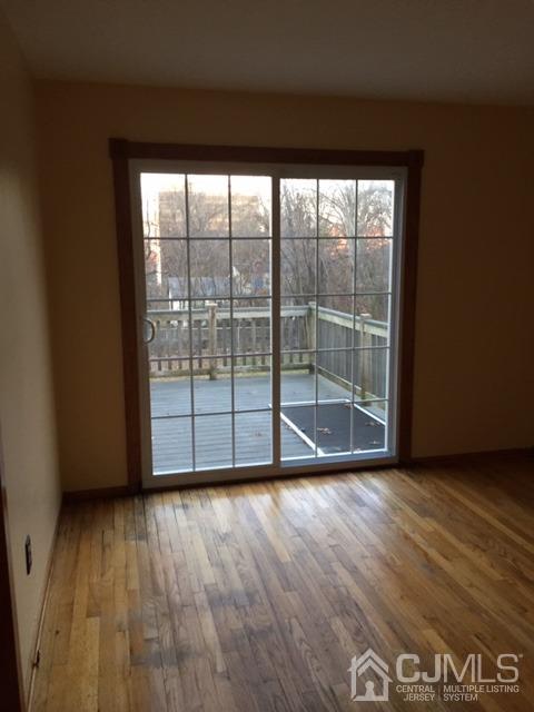 65 Tower Road Edison, NJ 08820 - Photo 2 of 11 a view of wooden floor and windows in a room