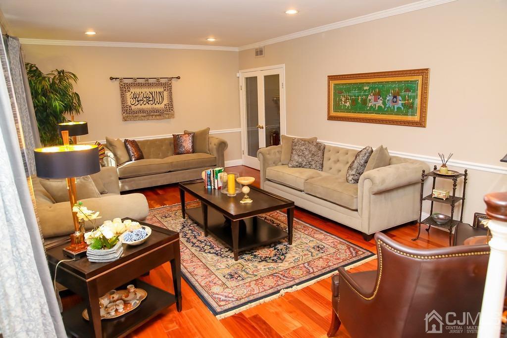 65 Tower Road Edison, NJ 08820 - Photo 4 of 11 a living room with furniture and a rug