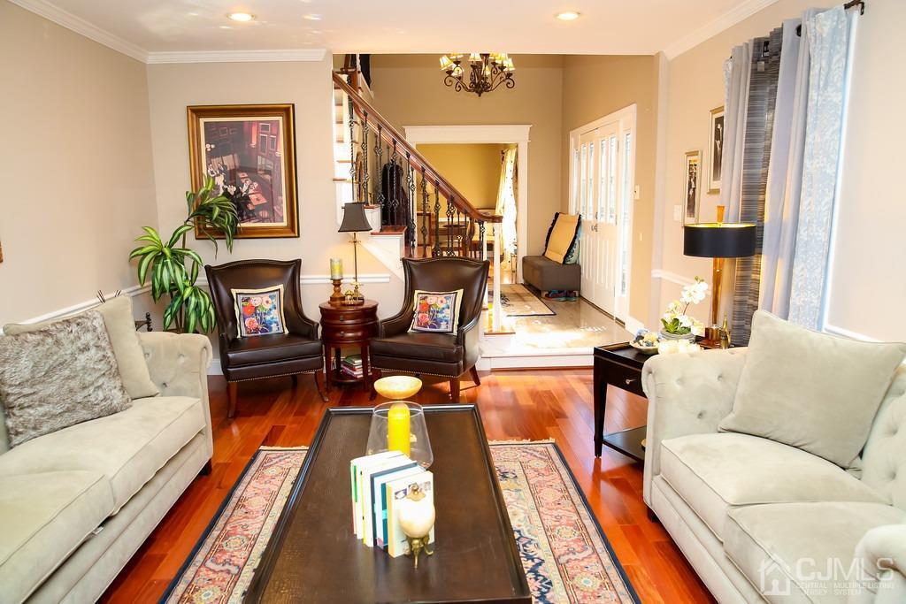 65 Tower Road Edison, NJ 08820 - Photo 5 of 11 a living room with furniture fireplace and a table