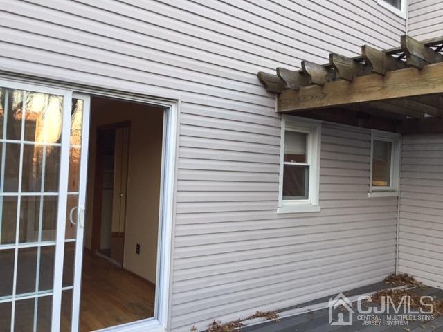 65 Tower Road Edison, NJ 08820 - Photo 7 of 11 a view of wooden house and a large window