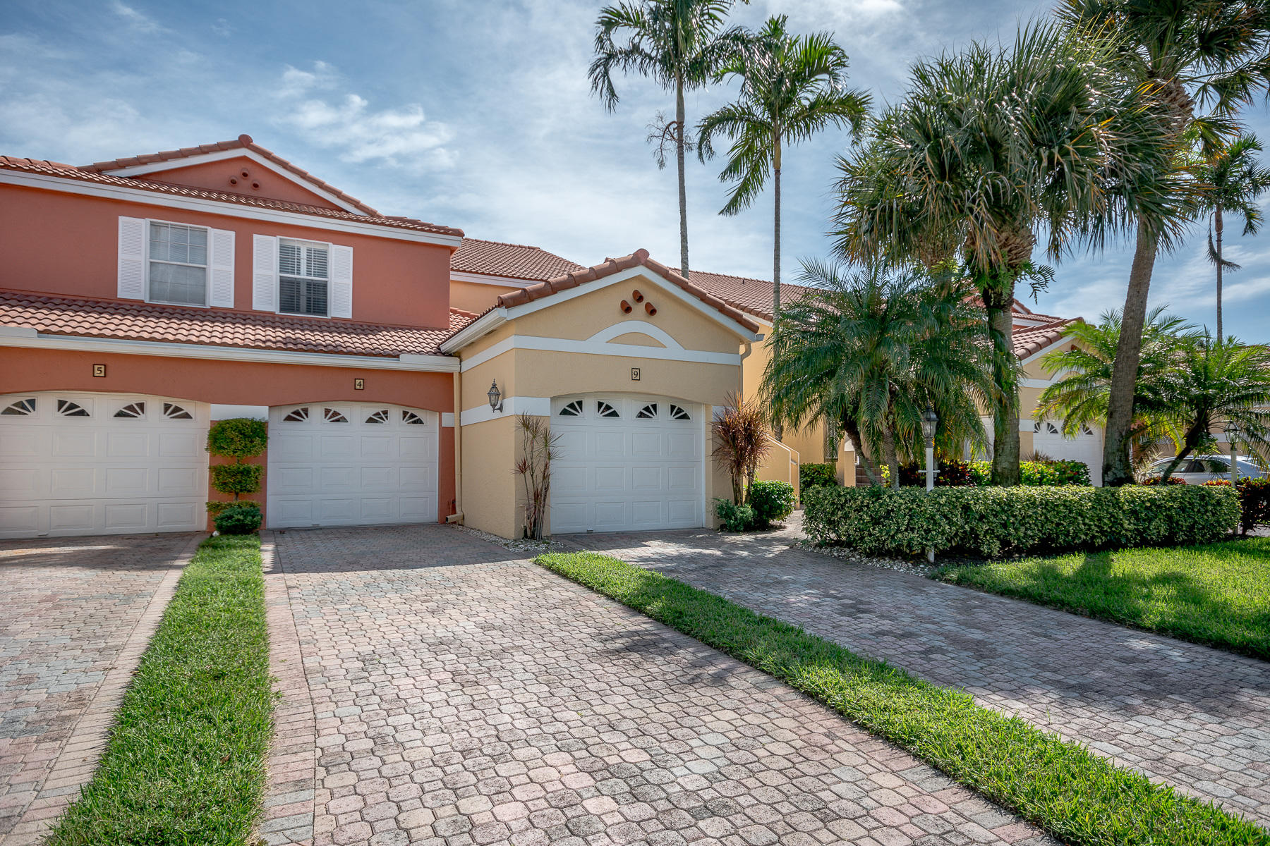 17050 Emile Street, Unit 4 Boca Raton, FL 33487 - Photo 1 of 32 a front view of a house with a yard and garage