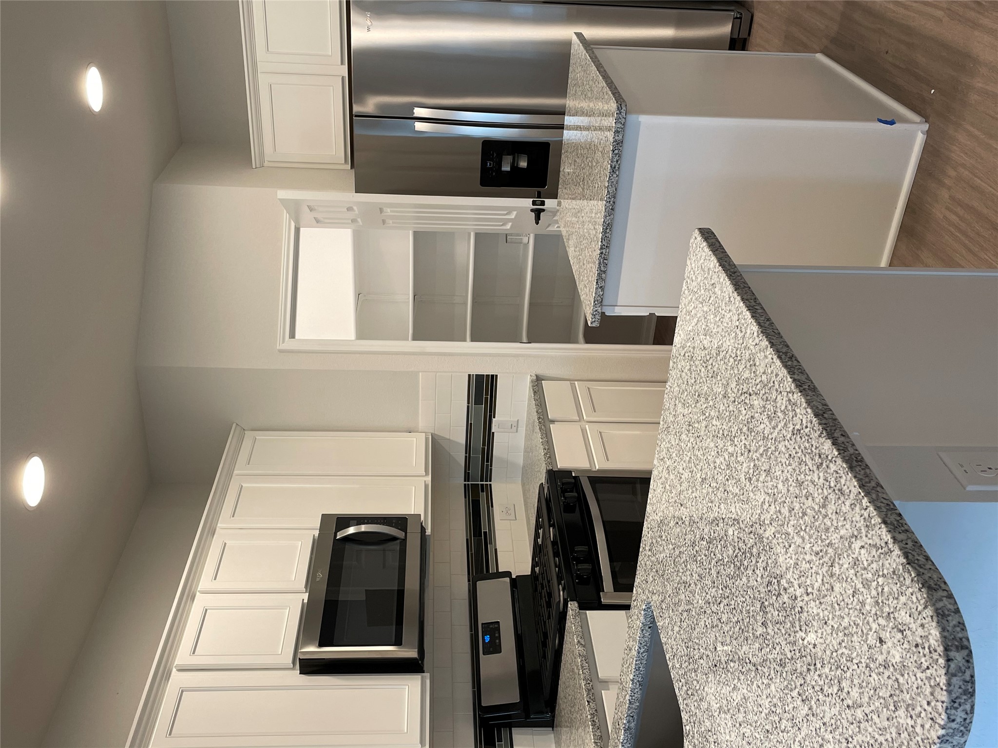 3908 Birdwatch Loop, Unit 56 Pflugerville, TX 78660 - Photo 8 of 30 a kitchen with stainless steel appliances granite countertop a sink stove and refrigerator